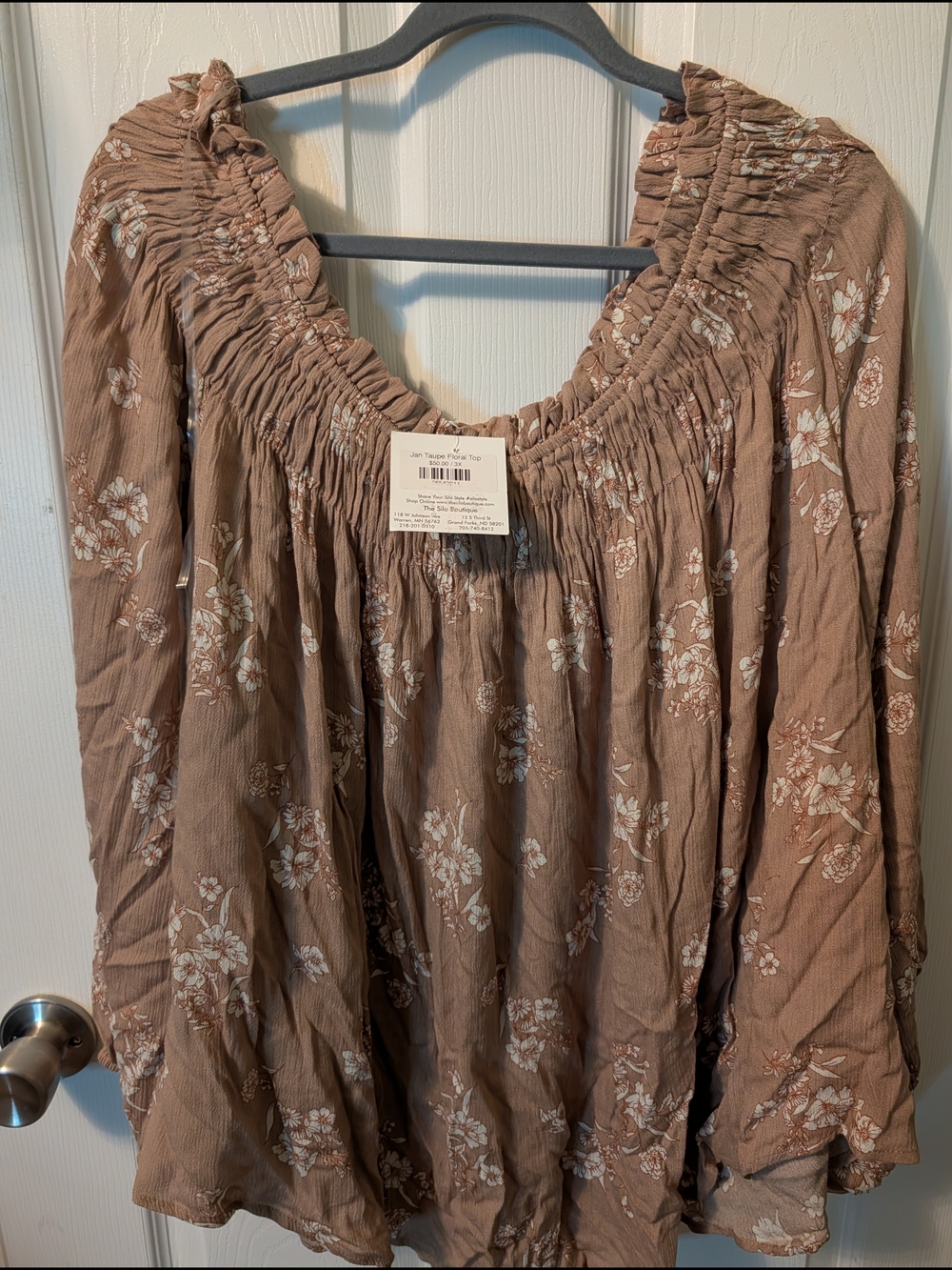 The O Boutique Taupe Floral Smocked Peasant Top